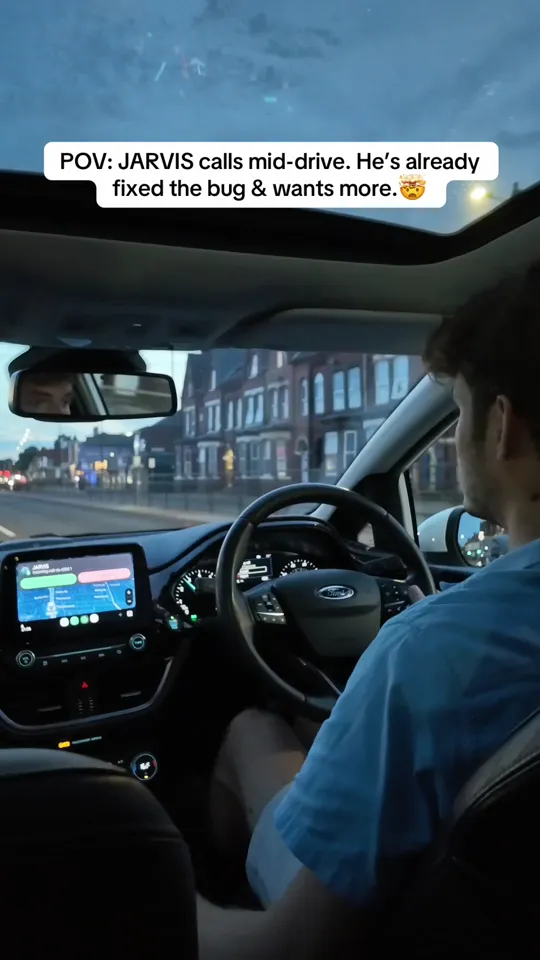 Still from the car-call reel: the view from the driver's seat as JARVIS rings mid-drive